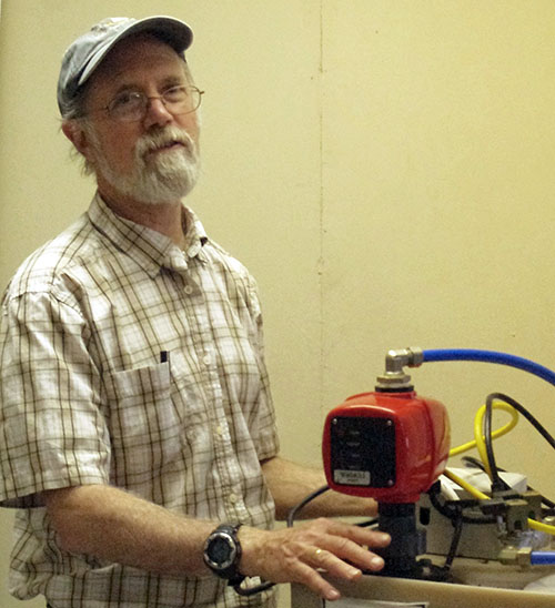 Radon Instructor Bill Brodhead demonstrates components of radon mitigation systems