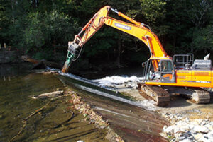 Construction vehicle removing Hughesville Dam on Musconetcong River