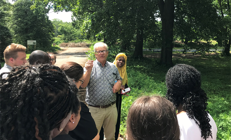 EPH students learn how to identify invasive plants during an outdoor lecture