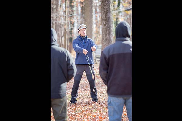 Instructor Mark Chisholm prepares the throw line during his tree climbing demonstration.