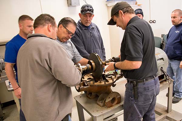 Students in the Operation and Maintenance of Pumps class participate in hands-on activities