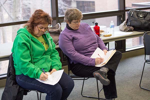 Course instructor Debbie DePew and OCPE Assistant Director Carol Broccoli take notes during the group presentations