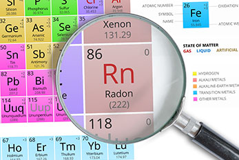 Radon Element on Periodic table magnified with magnifying glass