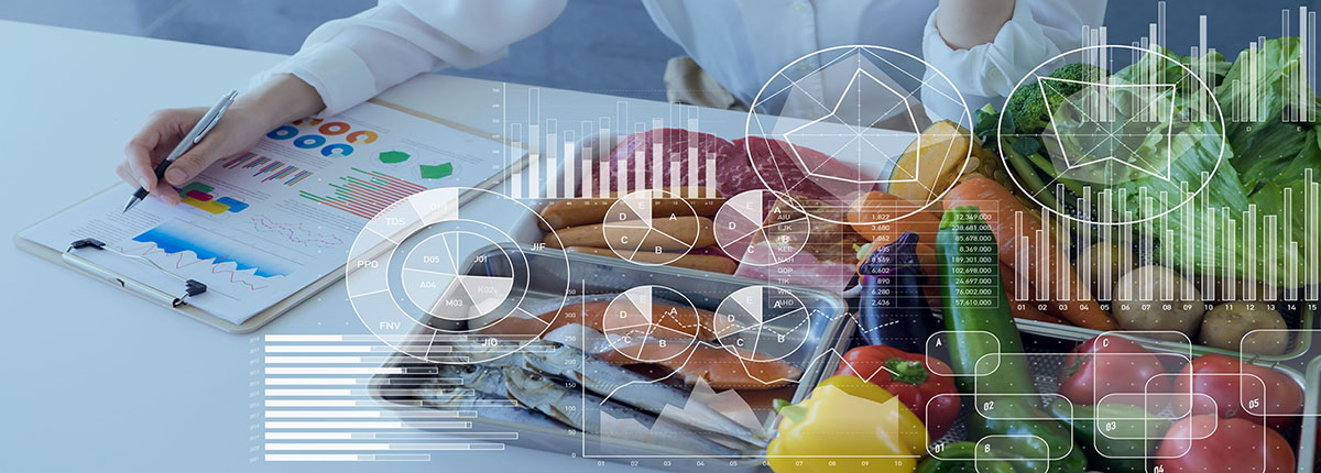 Charts and graphs overlayed on image of food scientist looking at data on clipboard next to food items on table